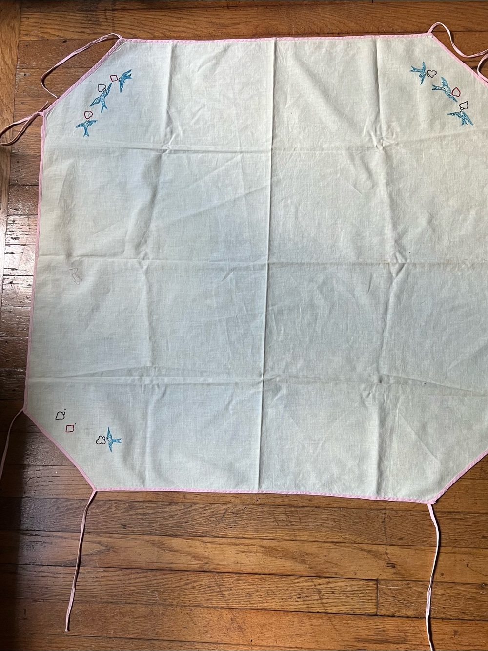 Vintage, hand embroidered card tablecloth with pink bias, tape ties